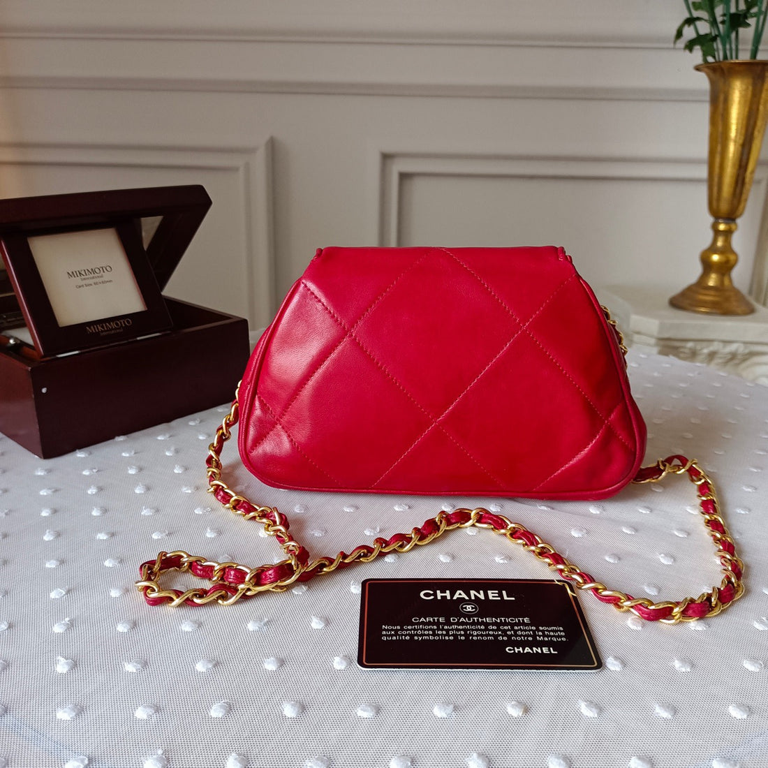 Chanel 1990s Vintage Crescent Bag in rare red lambskin. Includes original card and hologram (matching serial 1147112). Light surface wear consistent with B-grade; chain and interior pristine