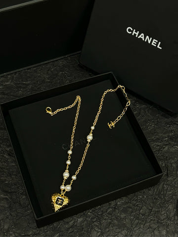 CHANEL 23K Black & Gold Heart Pearl Necklace (With Original Box • 49.5cm Gold-Tone Chain)